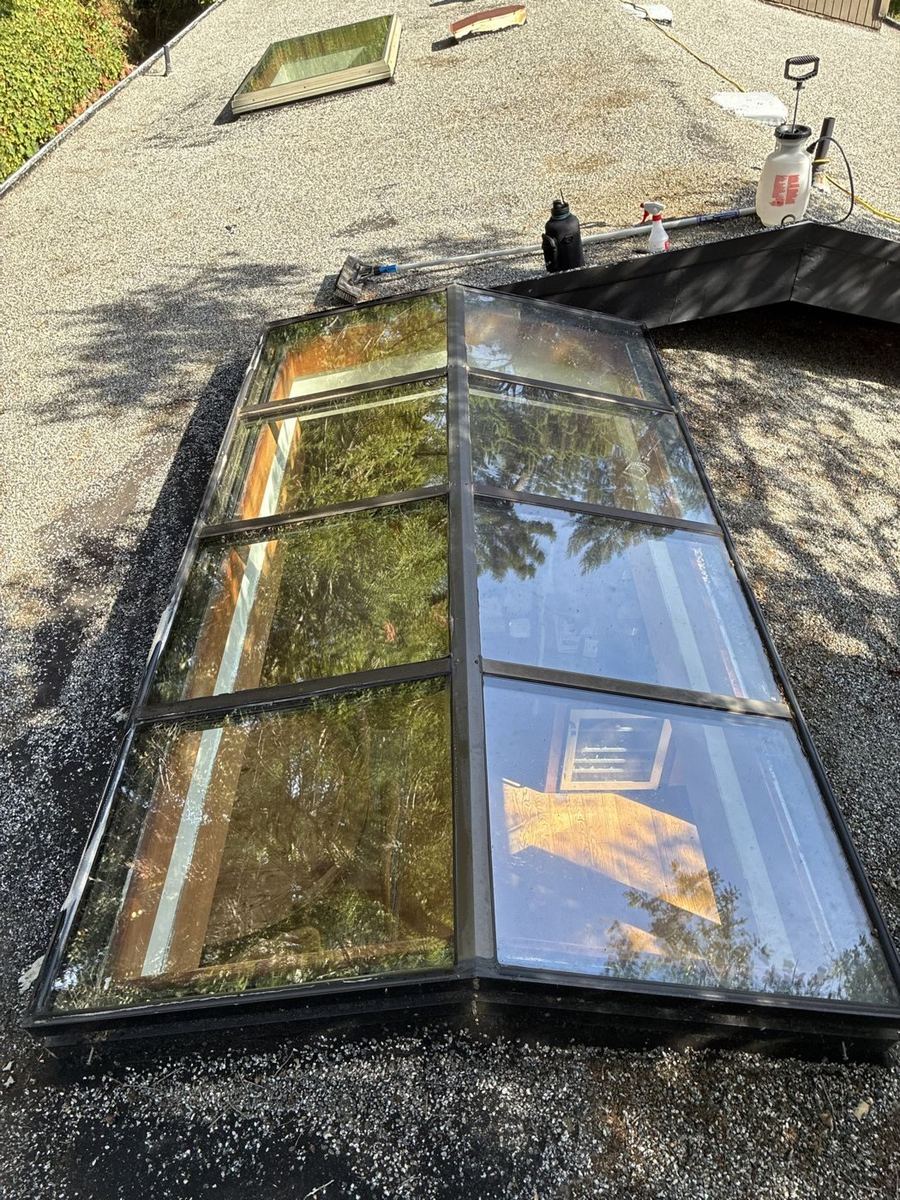 Large clean skylight on a gravel roof